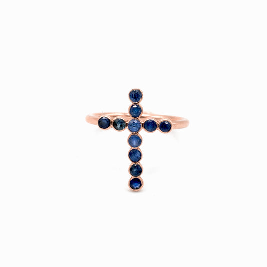 Gold cross ring with blue sapphire stones